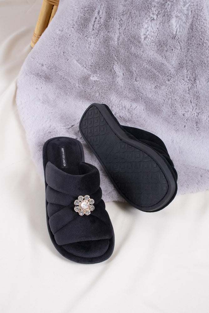 
                  
                    Faye women's slider slippers in raven combining brushed microfibre materials and a glimmering crystal brooch from Pretty You London
                  
                