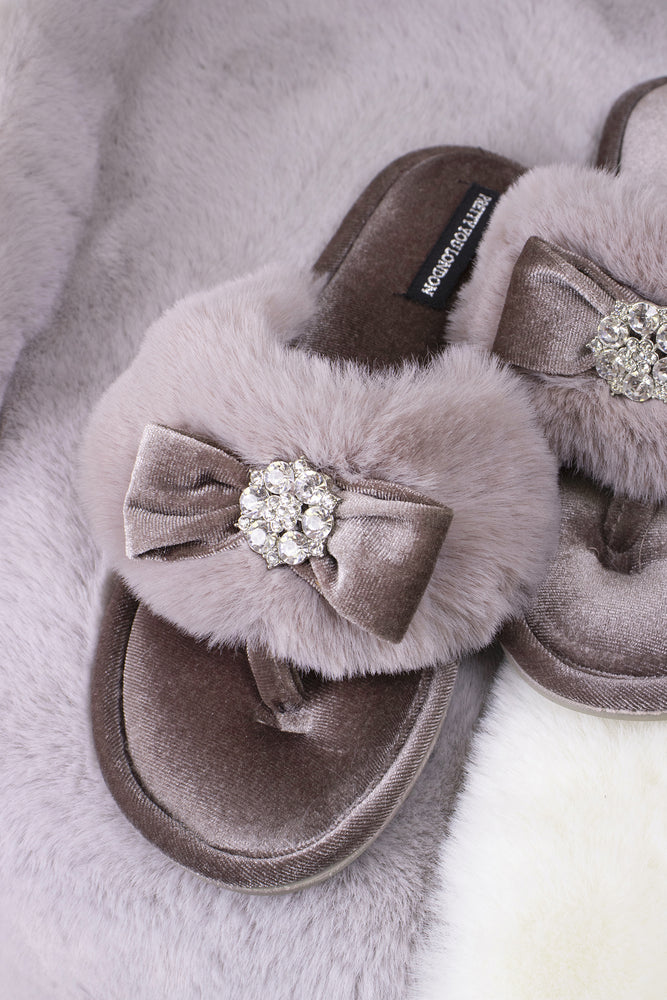 
                  
                    Amelie women's toe post slippers in mink with a premium velvet bow and diamante embellishment atop a plush faux fur band from Pretty You London
                  
                