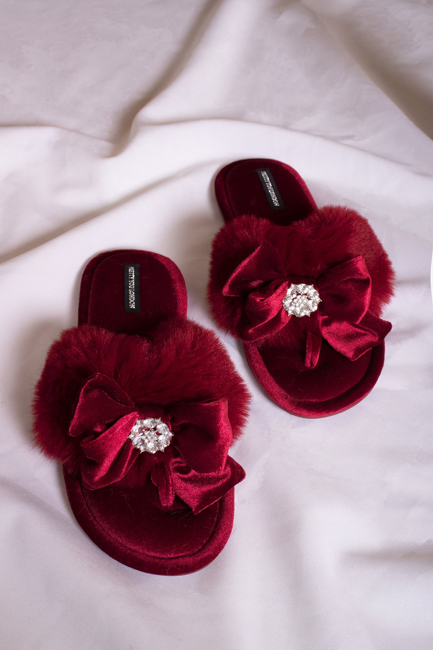 Amelie women's toe post slippers in red with a premium velvet bow and diamante embellishment atop a plush faux fur band from Pretty You London