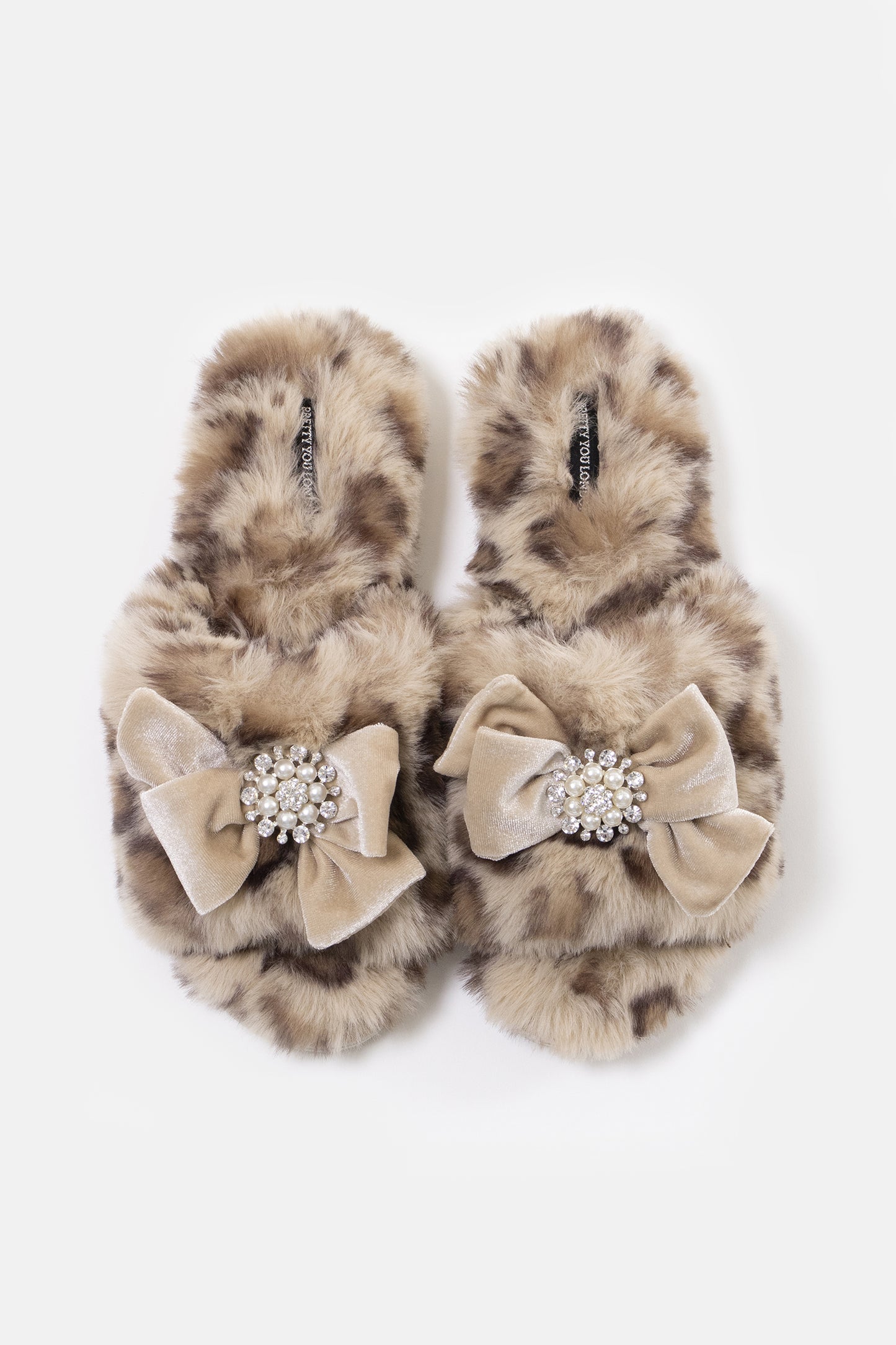 Anya women's slider slippers in leopard using the softest faux furs and topped with a premium grosgrain bow finished with a jewel pearl embellishment from Pretty You London