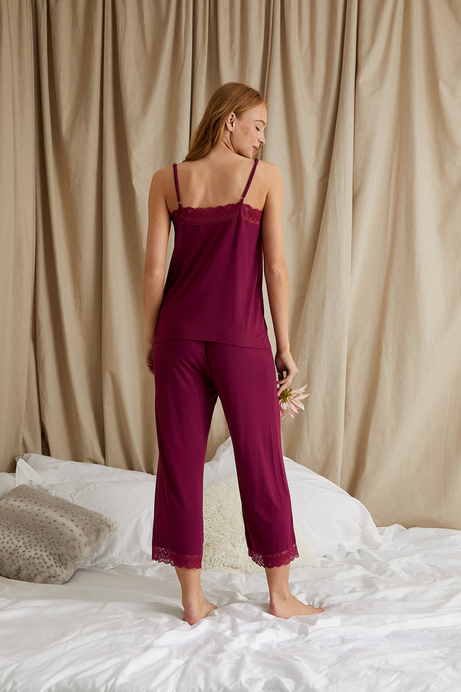 
                  
                    Women's Bamboo Lace Cami Cropped Trouser Pyjama Set in Bordeaux with delicate lace trims and adjustable straps from Pretty You London
                  
                