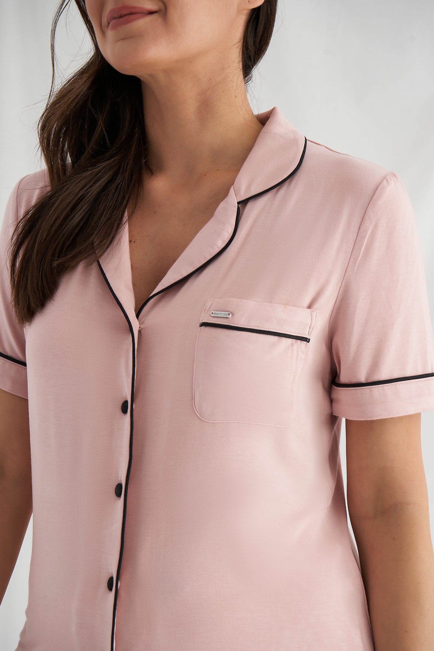 
                  
                    Women's Bamboo Shirt Short Pyjama Set in Pink with a revere collar and contrasting piping and satin bow from Pretty You London
                  
                