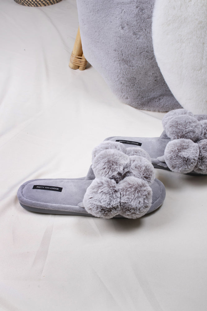 
                  
                    Dolly women's slider slippers in grey with oversized faux fur pom poms from Pretty You London
                  
                