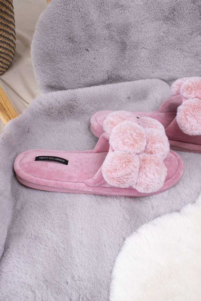 
                  
                    Dolly women's slider slippers in pink with oversized faux fur pom poms from Pretty You London
                  
                