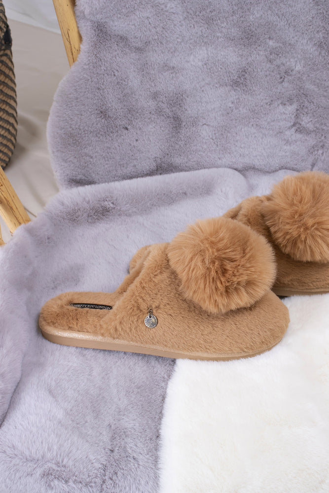 
                  
                    Etta women's mule slippers in camel with a statement oversized pom and metallic faux-suede binding from Pretty You London
                  
                