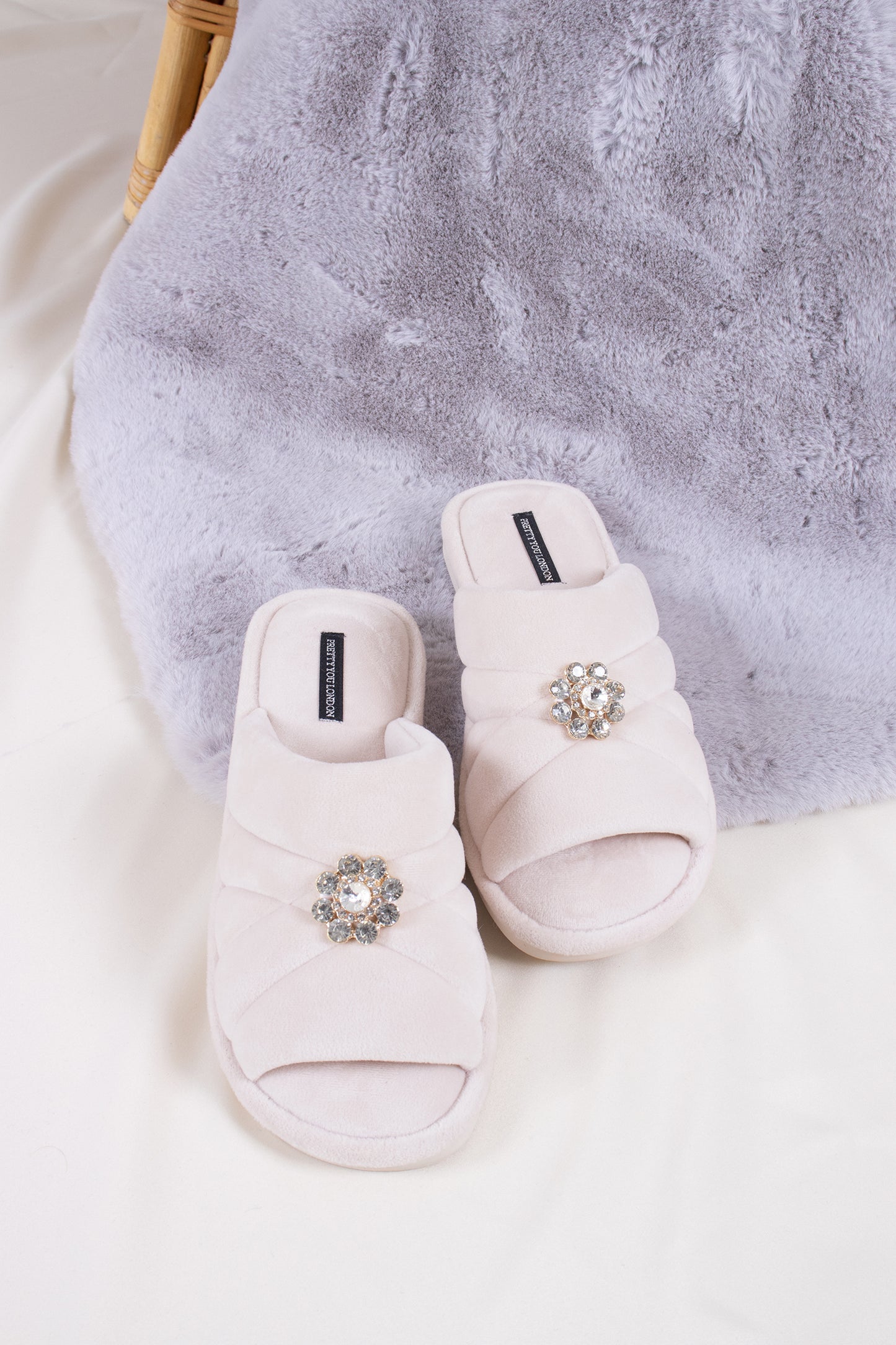 Faye women's slider slippers in powder puff pink combining brushed microfibre materials and a glimmering crystal brooch from Pretty You London