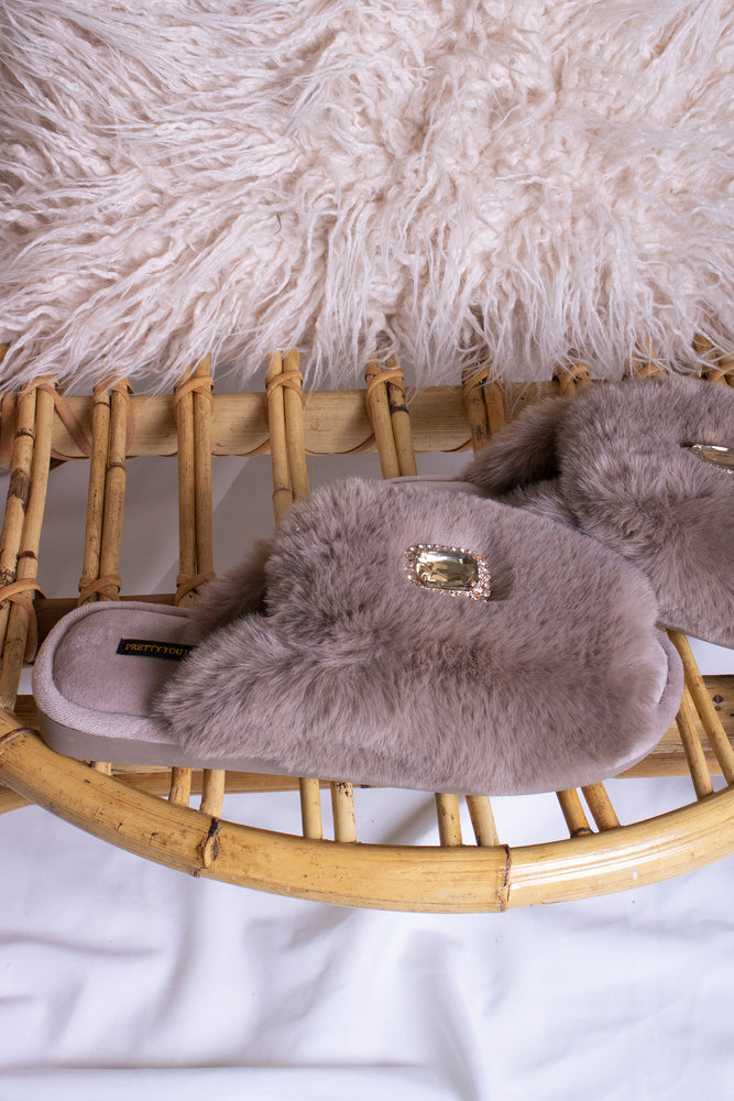 
                  
                    Fifi women's slider slippers in truffle with a crystal diamante brooch adorning the faux fur band from Pretty You London
                  
                