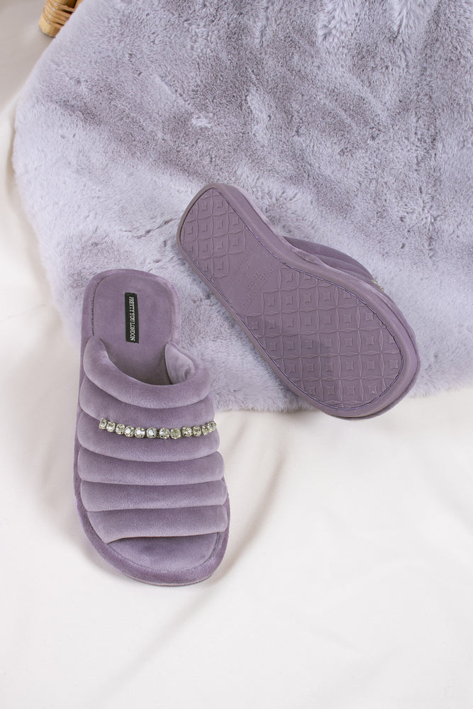 
                  
                    Frankie women's slider slippers in lavender combining super-soft microfibre materials with a glistening crystal diamante strap from Pretty You London
                  
                