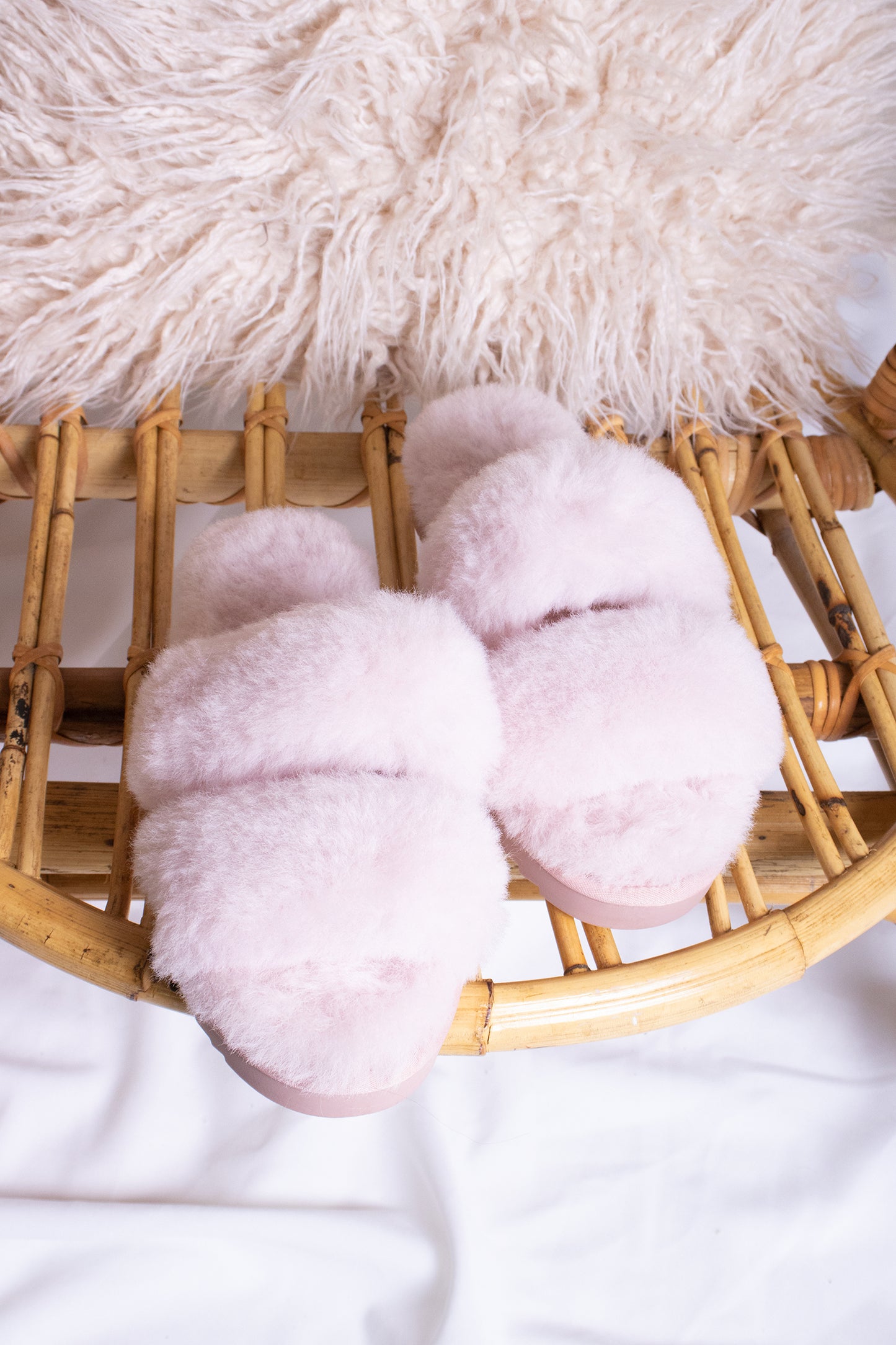 
                  
                    Jinx women's luxury sheepskin slippers in rose pink with a double band and open toe from Pretty You London
                  
                